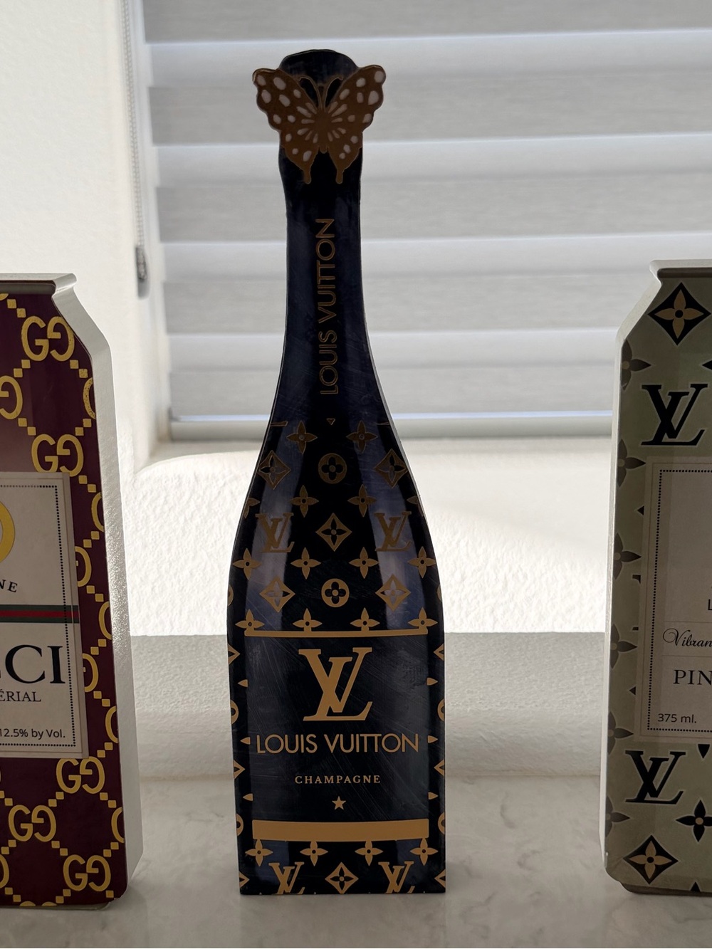 Louis Vuitton Black and Gold Monogram Champagne Bottle Décor